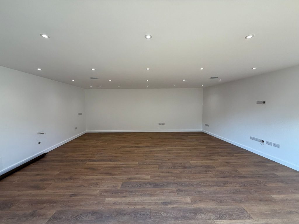 Fully insulated garden room interior with modern flooring and lighting